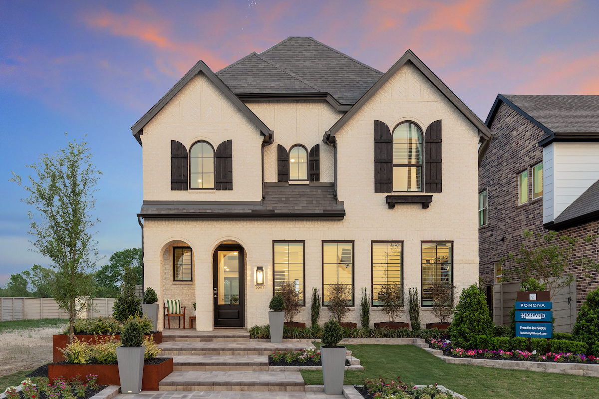 Pomona single family home with curated front yard against a sunset background. Pomona single family home with curated front yard against a sunset background.