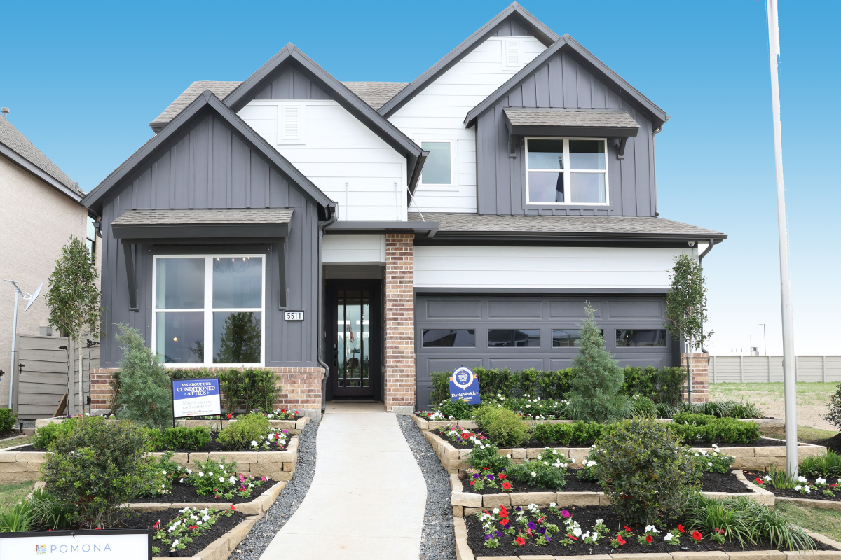 Single family model home at Pomona with a lush garden