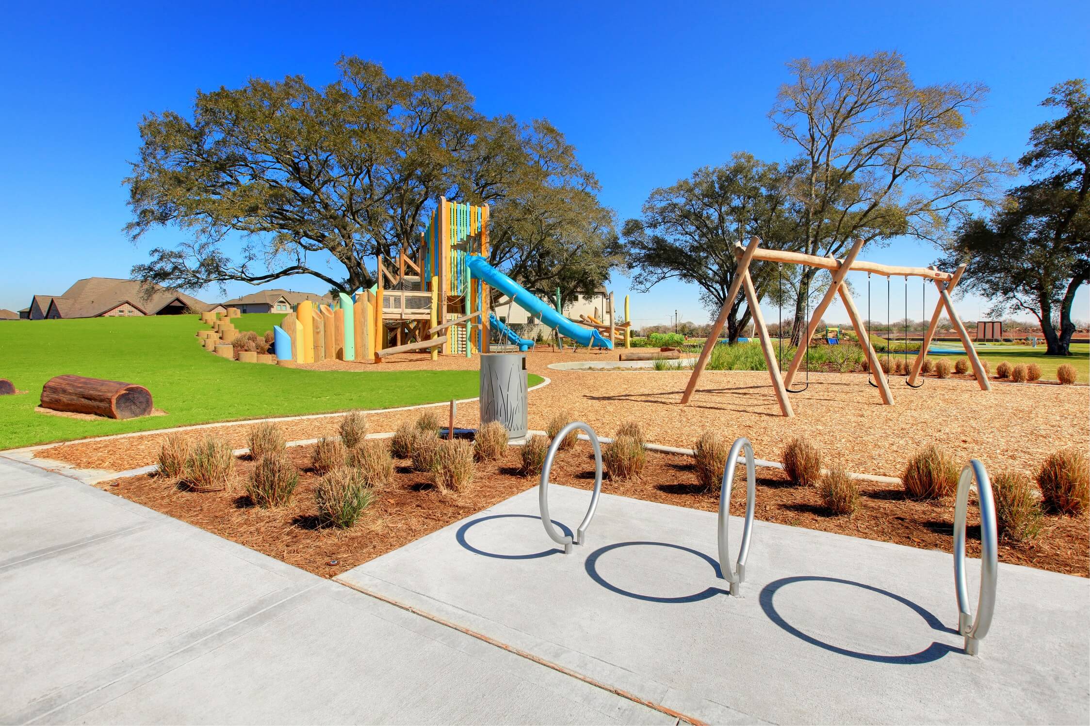 The Backyard Amenity at Pomona, featuring an outdoor playground, tree house, and fire pits The Backyard Amenity at Pomona, featuring an outdoor playground, tree house, and fire pits