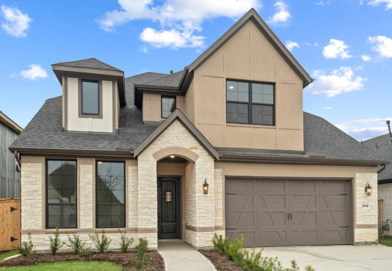 Valencia home with beige and tan exterior paint scheme and garden walkway. Valencia home with beige and tan exterior paint scheme and garden walkway.